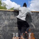 Person jumping over obstacle in Tough Mudder